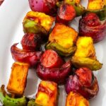 Pinterest graphic featuring grilled hot dog kabobs served on a white platter with grilled pineapple, peppers, and red onion. The image includes the recipe title and the Blogghetti Tested in My Kitchen badge.
