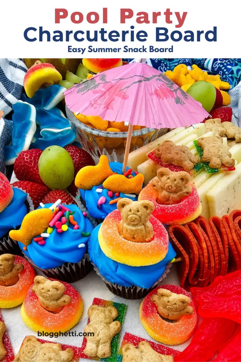 Pool party charcuterie board made with grocery store favorites including cupcakes, fruit, crackers, cheese, and summer-themed candy.