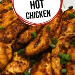 Grilled chicken tenders coated in a spicy homemade seasoning, served on a white platter and garnished with sliced green onions.
