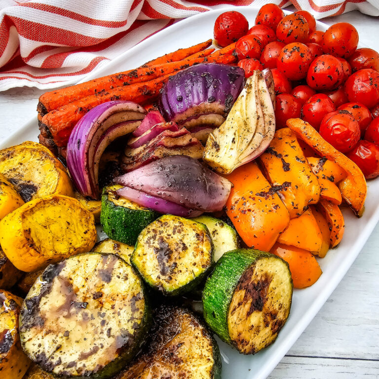 Grilled Vegetable Platter with colorful summer vegetables served on a white platter.