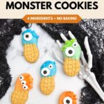 Blue, green, and orange Nutter Butter monster cookies with candy eyes and matching sprinkles are arranged among black lace and a skeleton hand. Text reads, “Easy Halloween Treat: Nutter Butter Monster Cookies, 4 Ingredients, No Baking.”