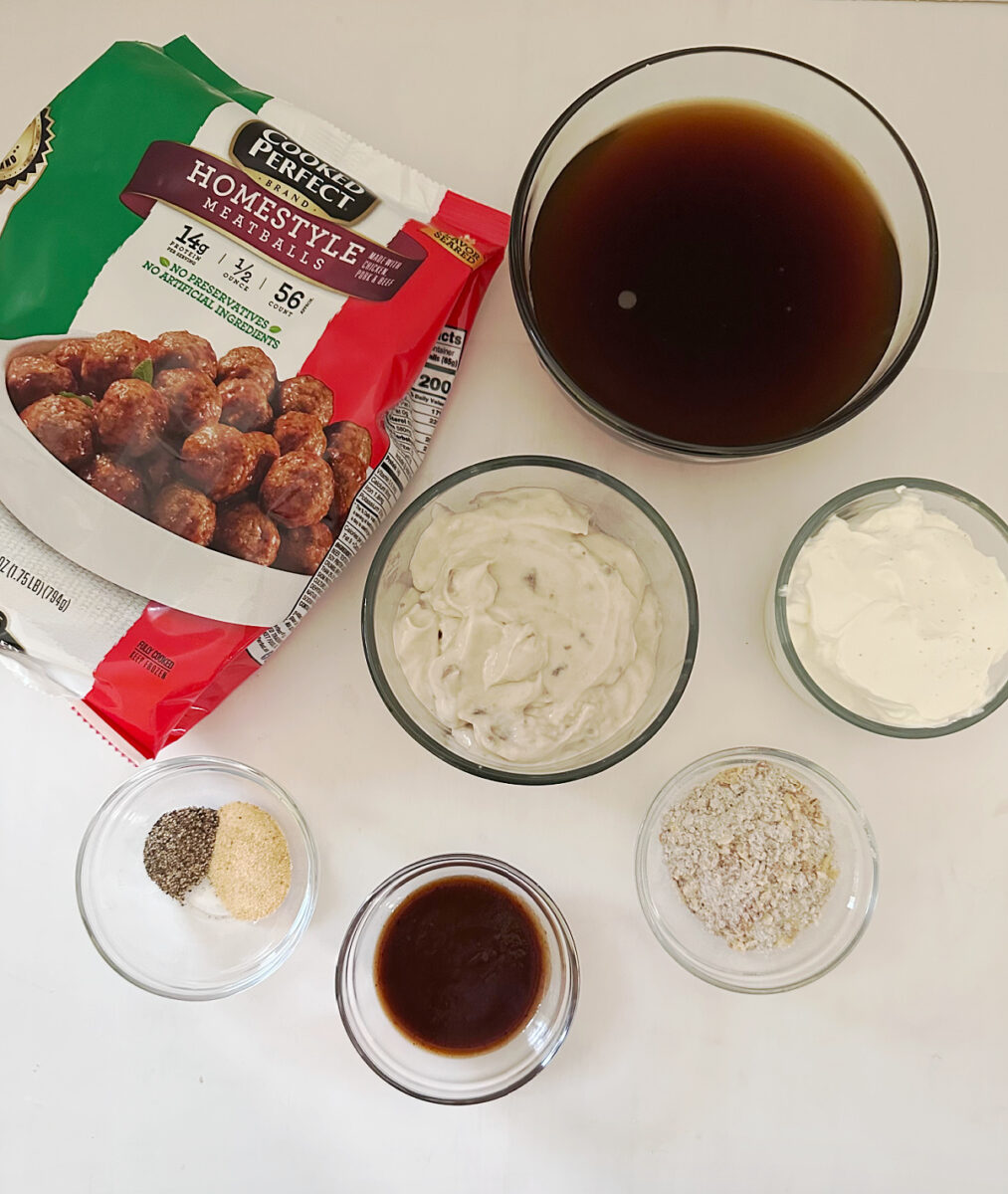 Frozen homestyle meatballs, beef stock, cream of mushroom soup, sour cream, onion soup mix, steak sauce, garlic powder, and black pepper.