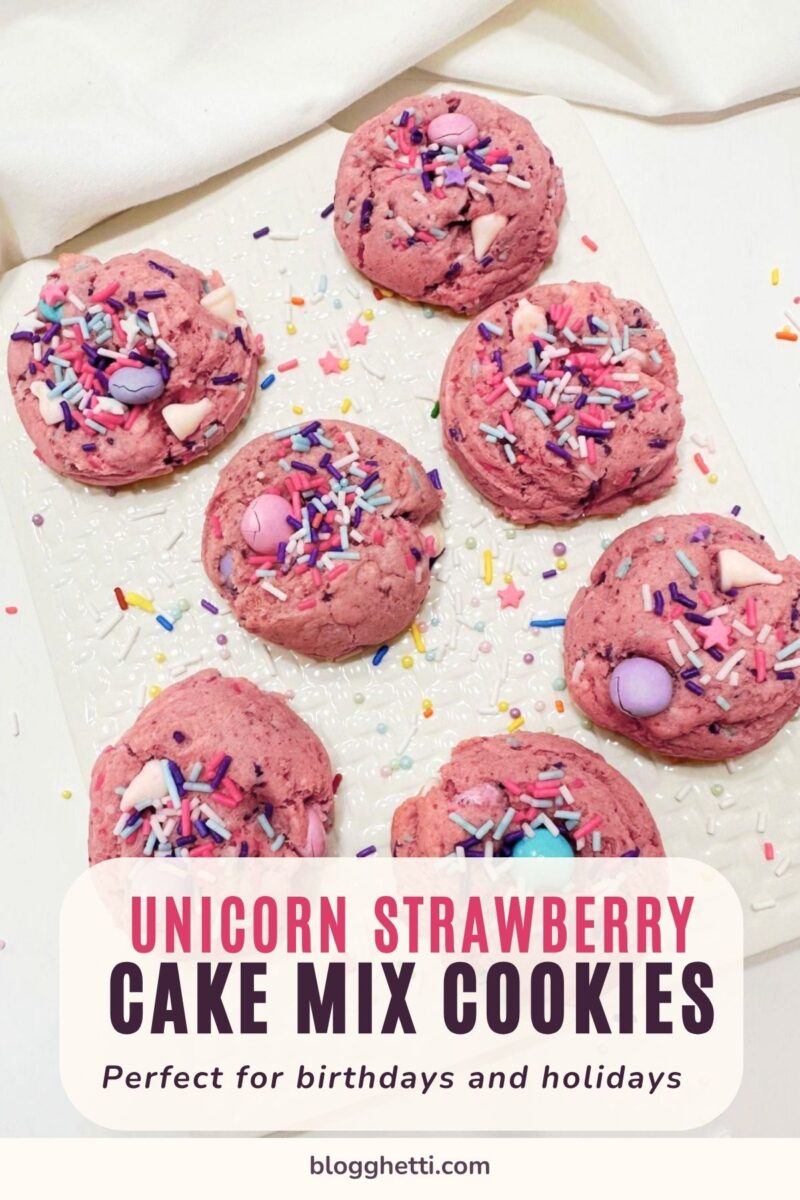 Pink strawberry cake mix cookies with pastel candy pieces and sprinkles on a white platter. Text reads “Unicorn Strawberry Cake Mix Cookies” and “Perfect for birthdays and holidays.”